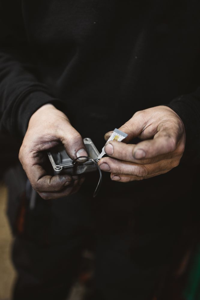 Crop man repairing detail