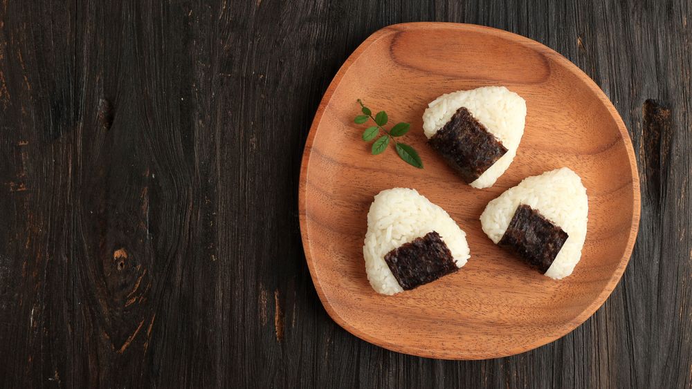 Top view of Japanese onigiri on wooden place