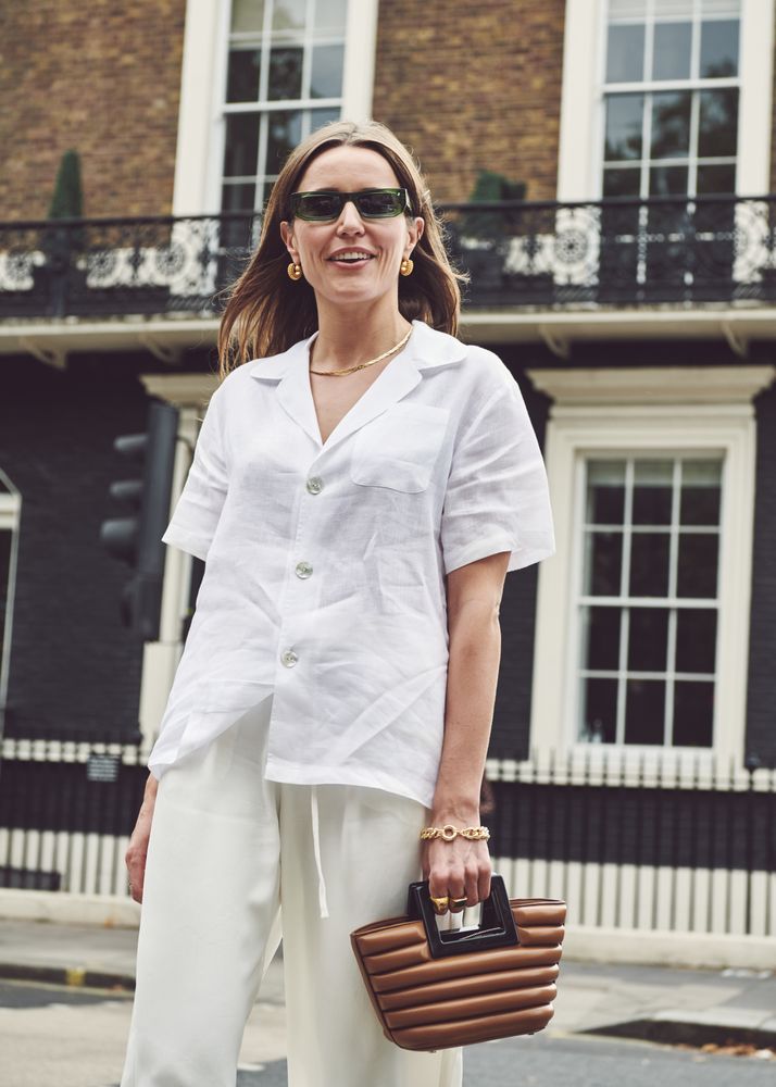 London, England, United Kingdom - September 18 2021: Smiling woman with handbag