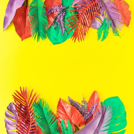 Painted tropical and palm leaves in vibrant bold colors on yellow background