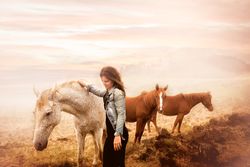 woman petting a horse