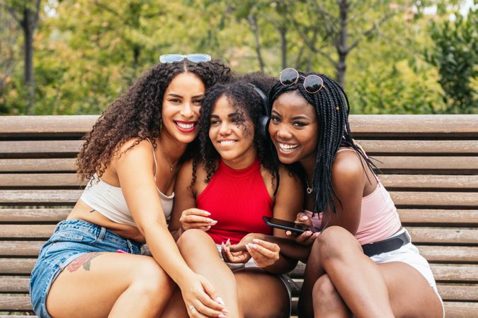 Black Friends Enjoying Summer Together and using smartphone