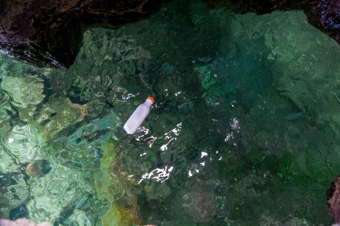 Plastic bottle floating on water