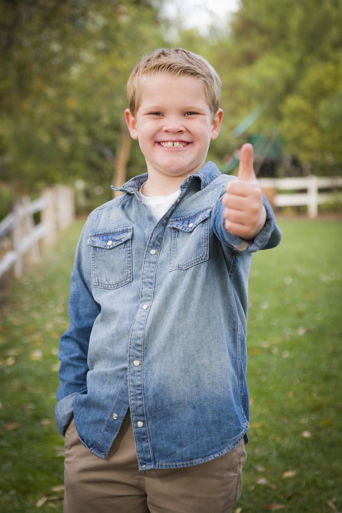 Handsome Young Boy Giving the Thumbs Up