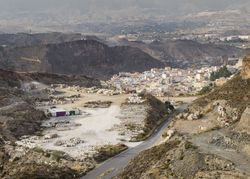 Drone view of village near stone quarry