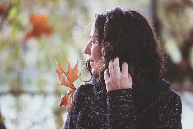 Dreamy female resting in autumn park