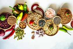 Top view of bowls of legumes and aromatics