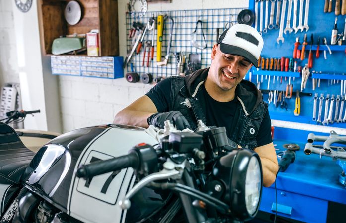 Mechanic cleaning a motorcycle
