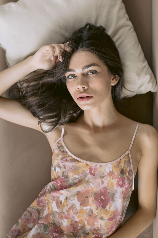 Aerial view of pretty woman laying on a sofa