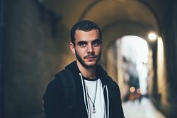 Portrait of a serious young man in an city’s underpass