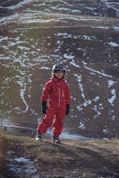 Boy looking at camera in spring in mountains