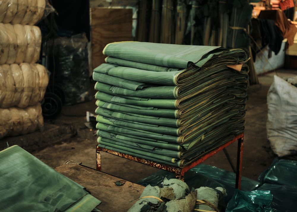 Pile of green banana leaves on sale