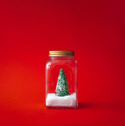 Christmas tree with snow in a glass jar