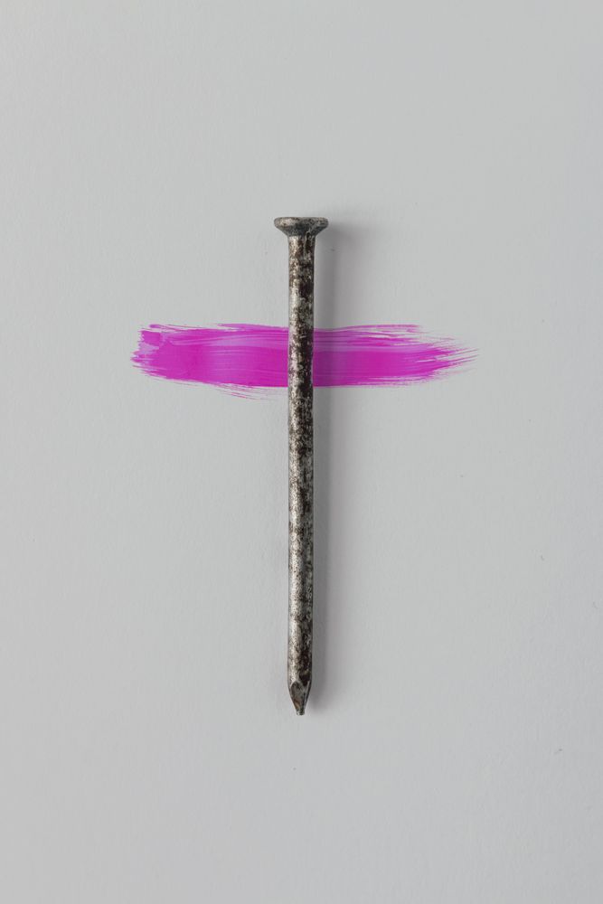 Nail on light background crossed with pink streak