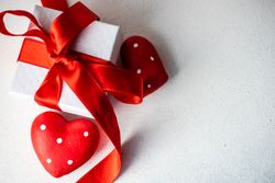 Top view of Valentine's day heart ornament with dots and gift box