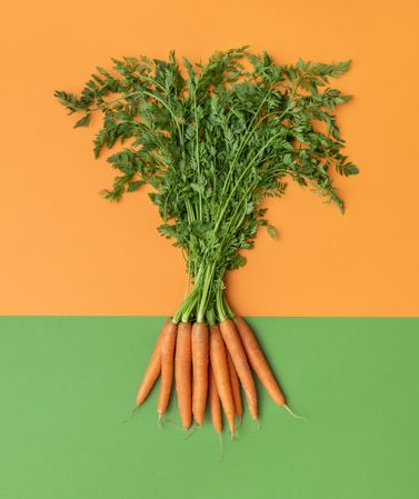Carrots with green leaves top view