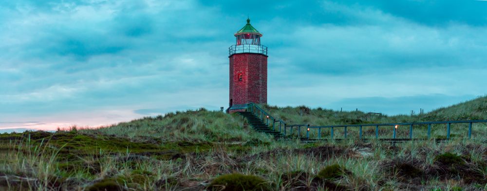 Wide shot of red lighthouse