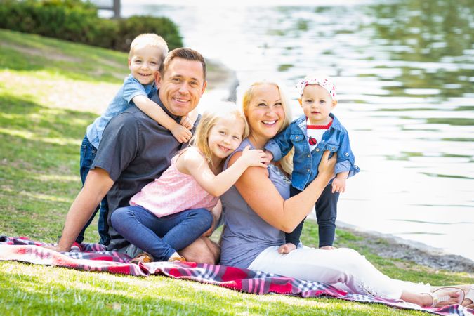 Happy Young Family Portrait In The Park