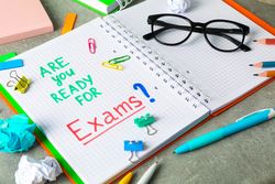 Composition with school supplies on grey background, space for text