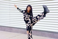 Woman kicking artfully outside
