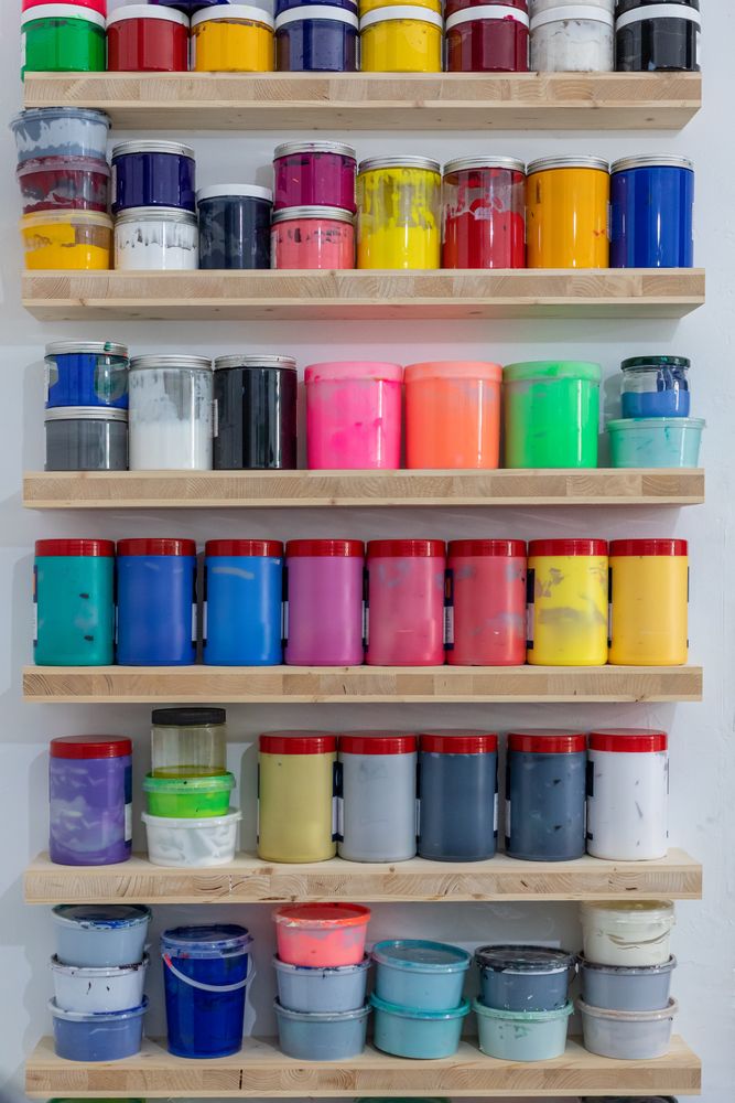 Shelves with colorful tins of paint
