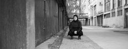 Woman in hijab smiling at camera