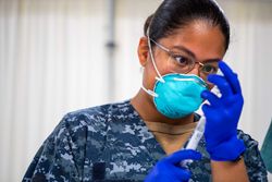 Los Angeles, CA, USA - April 17, 2020: Hospitalman prepares medication for patient