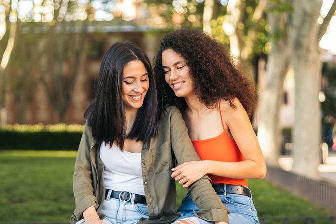 two young sitting in a park