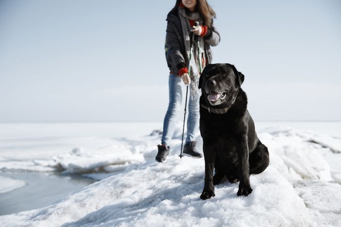 Young adult woman outdoors travelling in icy landscape