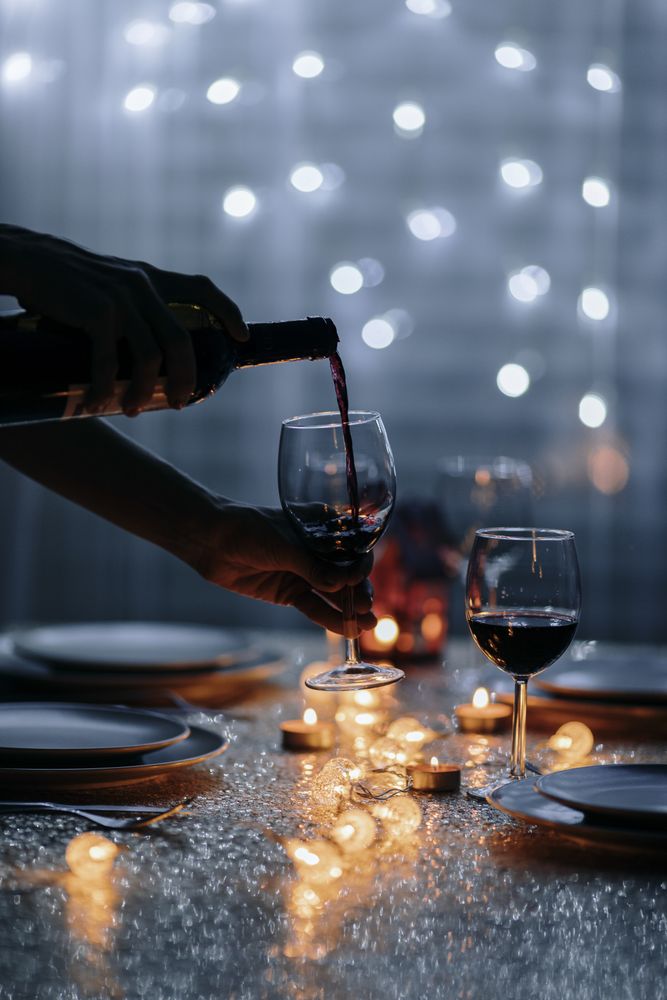 Wine glass lifted during pour
