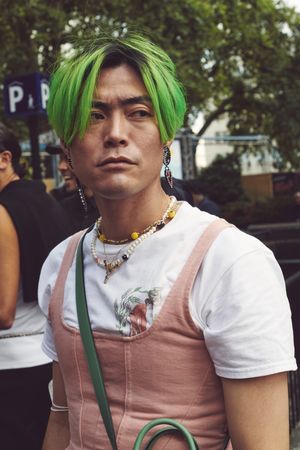 London, England, United Kingdom - September 18 2021: Asian man with green hair