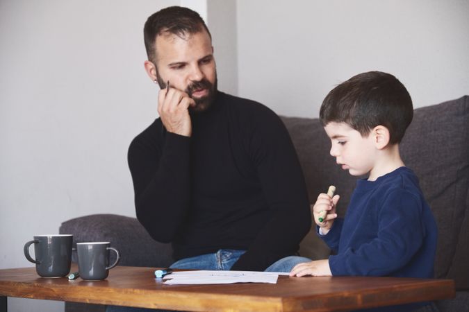 Father and son drawing together