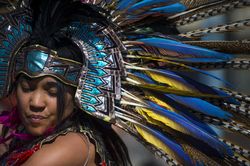 Des Moines, Iowa, USA - September 26, 2015: An Aztec heritage dancer wears traditional headdress 42X610