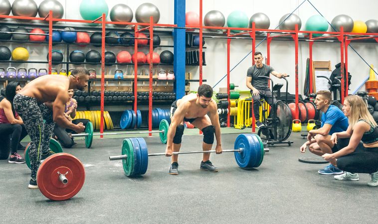 Strong man practicing weightlifting in the gym