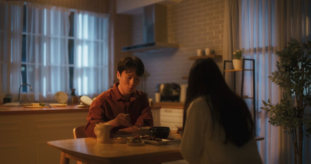 South Korean Young Couple Cooked Dinner at Home and Eating Food Together in the Kitchen.