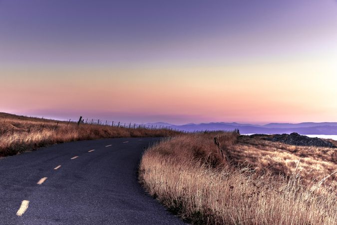 Road way atop hills leading to the coast
