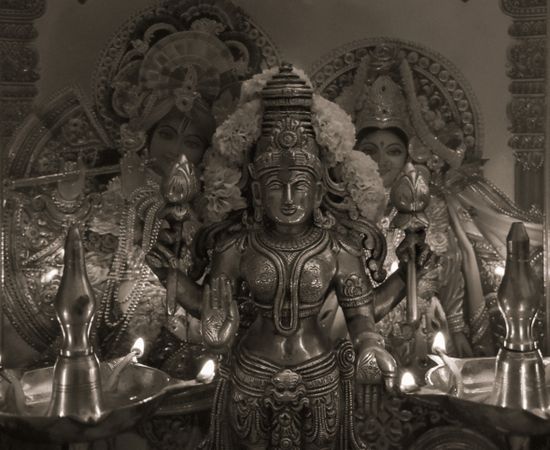 Grayscale photo of Lakshmi golden figurine