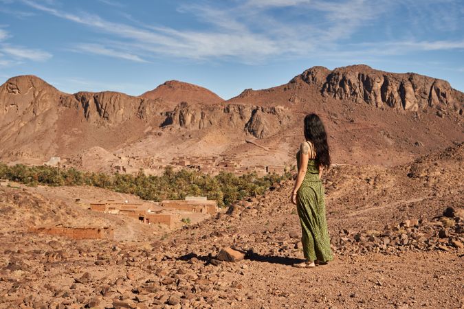 Woman between desert near mountains