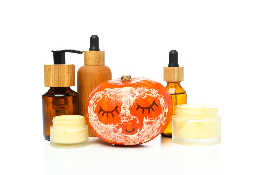 Skin care and body care concept - pumpkin cosmetic, isolated on blank background