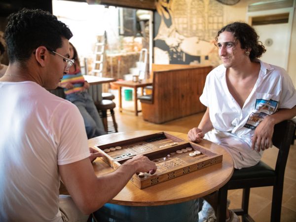 Two men playing backgammon at a cafe in Beirut