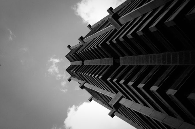 Low-angle view of a tall building in Johannesburg, South Africa in grayscale