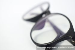 Close up of spectacles in plain studio background 49m9dL