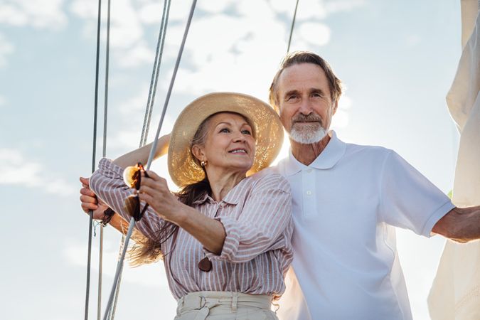 Mature couple relaxing on a sailboat