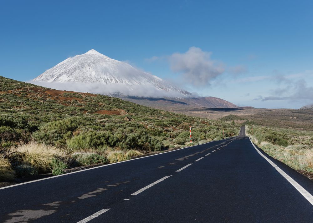 Countryside road near snowy mountain peak
