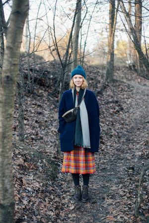 Red haired woman in forest on cold day