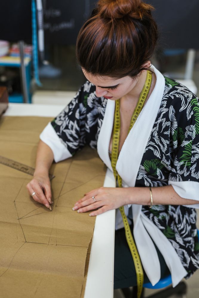 Woman in a sewing school