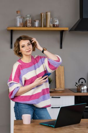 Relaxed Freelancer Workplace In Kitchen With Laptop