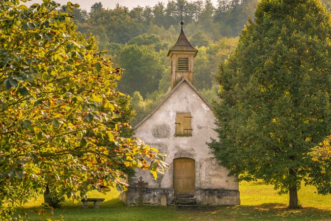 Abandoned old church and autumn trees