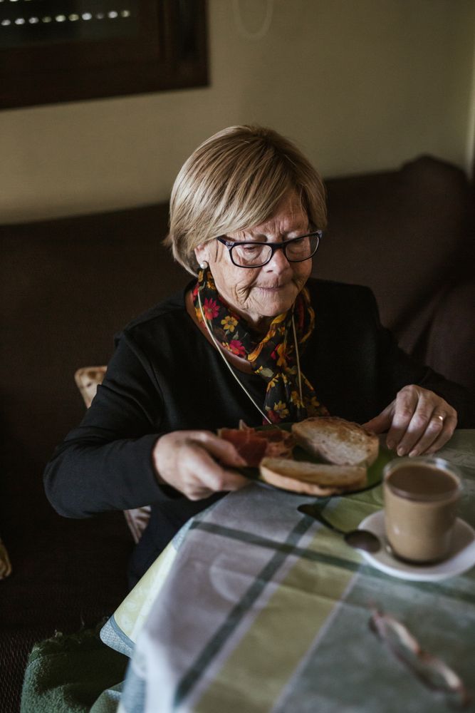 Older woman having breakfast