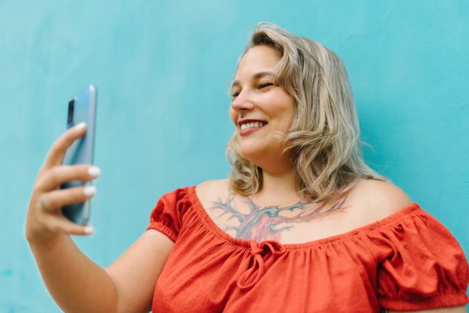 Young woman taking selfie on smartphone